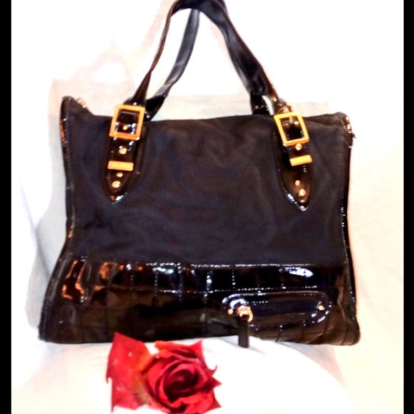 BCBGMaxAzria Handbags - Never used! BCBGMaxAzria Black satchel with gold detail